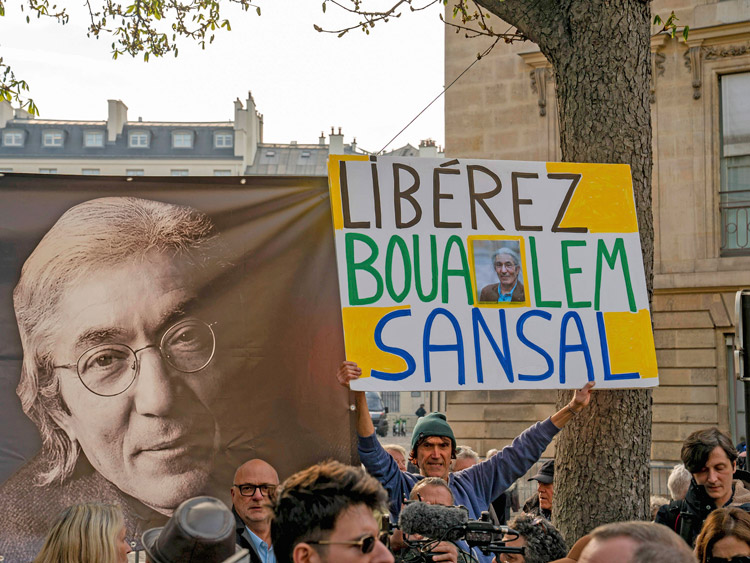 Worldwide protests freed author Boualem Sansal, a dual citizen of Algeria and France, from imprisonment in Algeria Nov. 12. Above, rally in Paris in March calls for his release.
