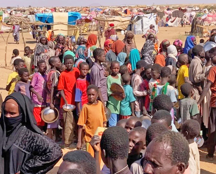 Thousands of people escape into refugee camp in Tawila, Sudan, Oct. 31. They were fleeing massacre by Rapid Support Forces, formerly Janjaweed militias, in el-Fasher in Darfur region.