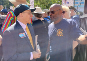 David Rosenfeld, left, SWP 2026 candidate for U.S. Senate from Illinois and SMART-TD member, talks with striking Teamsters member Linne Boyd at Chicago Labor Day march.