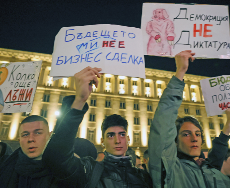 Rally against government budget proposals in Sofia, Bulgaria, Dec. 1. Signs read from left, “How many more lies?” “The future is not a business deal” and “Democracy is not a dictatorship.” Economic, social and political crisis led to weeks of large, angry protests.