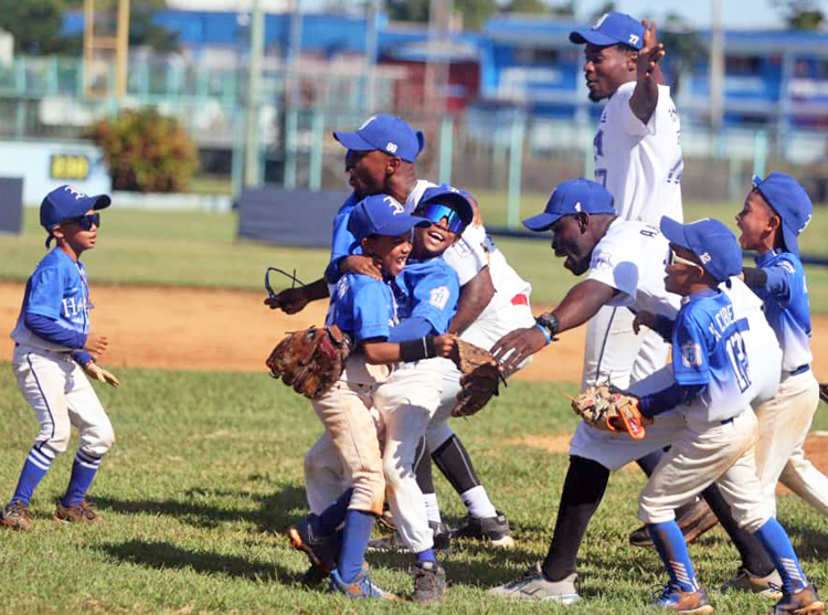 Havana Little League team celebrates win Dec. 14. Since the revolution, Cuba has won more gold medals at Pan American, summer Olympics than anyone in the hemisphere, except U.S.