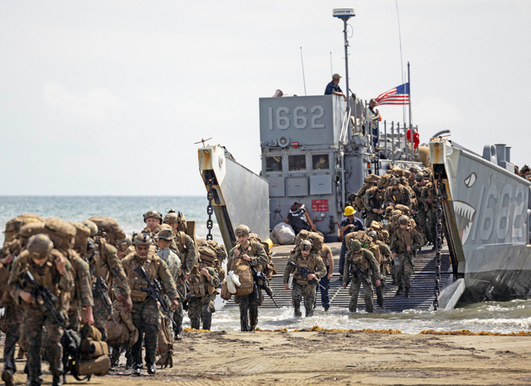 U.S. Marines practice landings in Arroyo, Puerto Rico, Oct. 16. Trump administration threatens invasion to pressure Venezuelan government, assert its domination of Latin America.