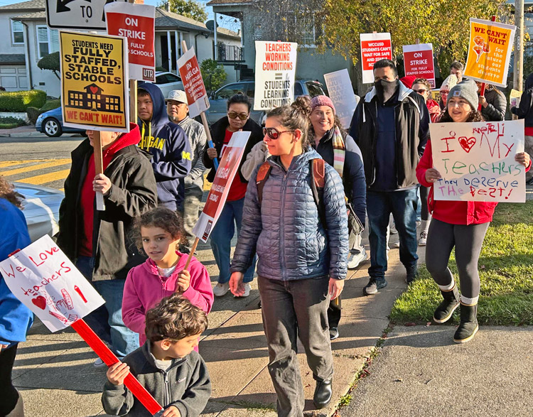 Teachers on strike against the West Contra Costa Unified School District and supporters march in Richmond, California, Dec. 6. Fight is over higher wages and for hiring more teachers.
