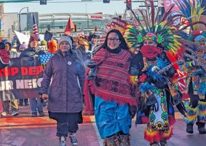 Protest in Minneapolis Dec. 20 against ICE raids and deportations of immigrant workers. A contingent of Native American dancers, some with Mexican heritage, led the march.