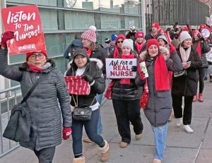 Members of New York State Nurses Association picket Jan. 13 at New York-Presbyterian hospital. Nurses have won broad support in fight for working conditions that can improve care.