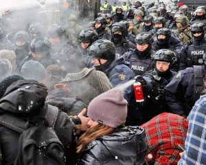 Police use pepper spray as they assault truckers and other protesters in Ottawa Feb. 19, 2022. Federal government used the Emergencies Act to attack free speech, right to protest.