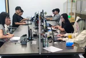With high youth unemployment in China, many students who can’t find jobs pay for the “privilege” of pretending to work to fulfill university diploma requirements, reassure their parents. Above, mock office with students at Pretend to Work Company in Hangzhou, China.