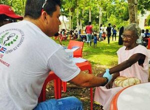 Doctor from Cuba’s internationalist medical mission treats patient in Haiti. Cuba contributes to economic, social and cultural development of many Caribbean nations, without conditions.