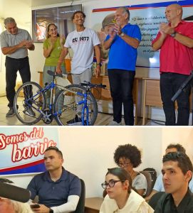 Feb. 19 Havana event awards winners of photo contest. From left, Edwin González, delegate to Puerto Rican Mission to Cuba; Yanet Cáceres of Casa Editora Abril; contestant César Gabriel García, with bicycle he was awarded; along with René González, one of Cuban Five; and Gerardo Hernández, another member of the Cuban Five and head of Cuba’s Committees for the Defense of the Revolution. Below, part of audience enjoys the solidarity and fun.
