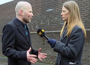 Hugo Wils, Communist League candidate for Parliament in Gorton and Denton constituency, interviewed by Politics Joe internet reporter at Birmingham refuse strikers picket line Jan. 30.