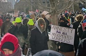 Thousands joined nationwide protests Jan. 23 to defend rights of immigrant workers against ICE assaults. Above, union-sponsored march in Minneapolis set disciplined, peaceful example.
