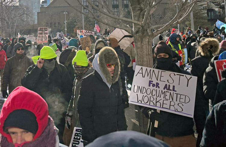 Thousands joined nationwide protests Jan. 23 to defend rights of immigrant workers against ICE assaults. Above, union-sponsored march in Minneapolis set disciplined, peaceful example.