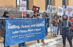 Letter carriers from four NALC union locals rally for just contract in Minneapolis Feb. 22, as national protests by the union demand higher pay, especially for new hires, and more workers.