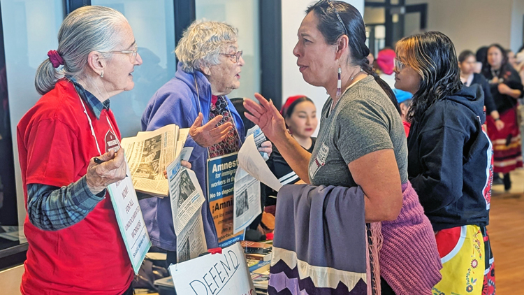 Socialist Workers Party members, from left, Joanne Murphy and Helen Meyers speak to participants at Missing and Murdered Indigenous Relatives action Feb. 14 in Minneapolis.