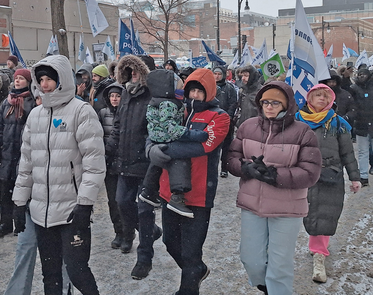 Marchers in Montreal joined demonstrators across Quebec Feb. 7 to defend the rights of immigrant workers. The increased presence of union banners and contingents was striking.