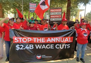 Over 100 farmworkers and supporters rallied at federal courthouse in Fresno, California, March 18 to oppose stiff wage cuts imposed by government on workers with H-2A visas.