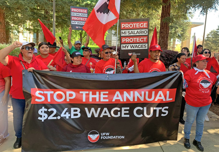 Over 100 farmworkers and supporters rallied at federal courthouse in Fresno, California, March 18 to oppose stiff wage cuts imposed by government on workers with H-2A visas.