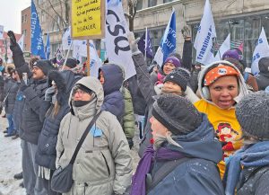 More than 1,000 marchers in Montreal joined with actions across Quebec Feb. 7 protesting gov’t attacks on status of immigrant workers. Union contingents, banners marked the protests.