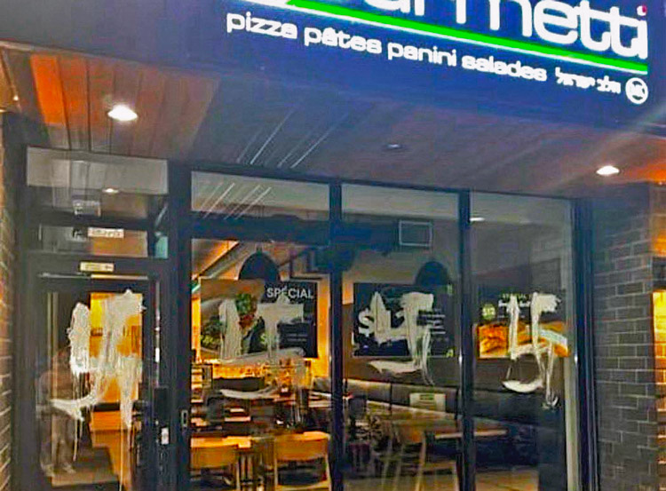 Swastikas painted on front of Kosher Pizza Gourmetti in Montreal March 4. That week, three synagogues in Toronto were hit with gunfire, Montreal businesses smeared with Nazi graffiti.