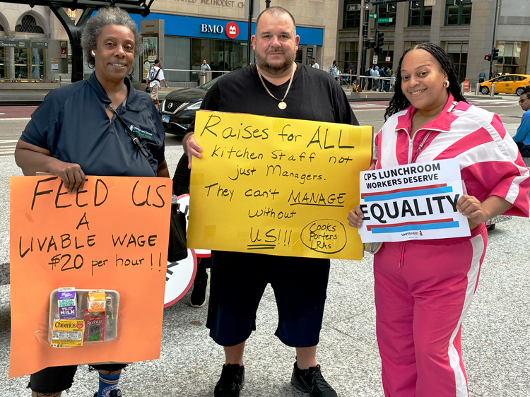 Chicago Public School lunchroom workers rallied April 23 for more staffing and higher wages. From left, Evette Coleman, kitchen worker at Pershing Elementary school; David Smith, porter at Sheridan Elementary school; and Miss Venus, the head cook at Sheridan Elementary.