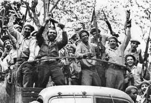 Cuban militia members celebrate after April 1961 victory over U.S.-sponsored mercenary force, helping transform their country, themselves as they set example for workers worldwide.
