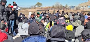 UFCW Local 7 President Kim Cordova speaks to hundreds of JBS workers on status of fight with bosses April 3, translated into Spanish, Haitian Creole, Burmese, Somali. Workers cheered when she said company would pay workers back for mesh gloves and vests they were forced to buy.