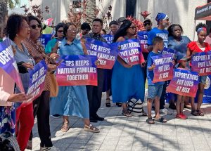 Some 200 Haitians and supporters rally in North Miami, Florida, April 26 to demand extension of Temporary Protected Status that could affect ability of 350,000 Haitians to remain in U.S.
