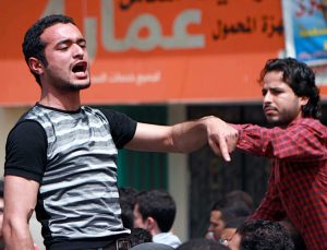Ahmed Douma at 2011 march in Tahrir Square, Cairo. A poet and political activist, he was arrested, imprisoned on frame-up charges of “publishing false news” April 6.