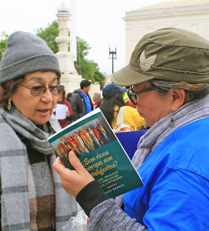 Arlene Rubinstein, left, speaking with participant at April 29 action at U.S. Supreme Court in Washington, D.C., to defend Temporary Protected Status for Haitians and Syrians.