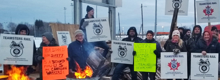 During 2019 Canadian National Railway strike, Dave Prince, behind burn barrel near center, and fellow SWP National Committee member Mary Martin, second from left, joined Teamsters Canada members at Quebec City picket Nov. 24. Fight over safety for workers and nearby communities was at the center of the strike.