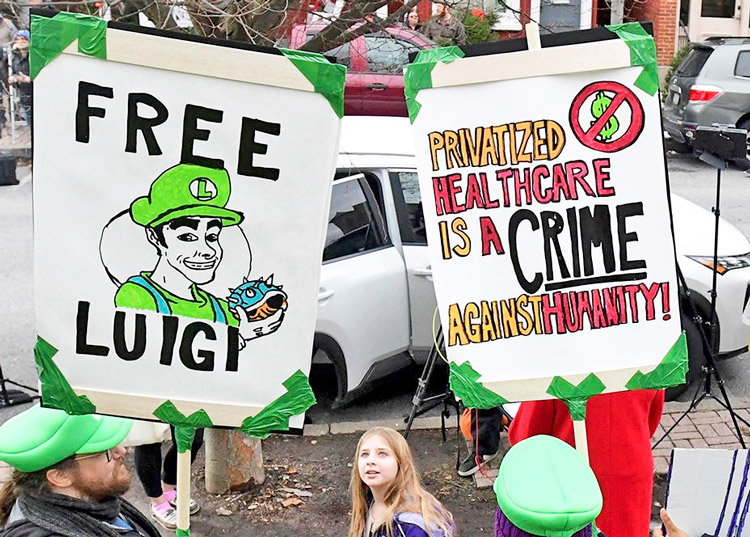 Leftist backers of Luigi Mangione, charged with murder of UnitedHealthcare CEO Brian Thompson, celebrate him outside hearing in Hollidaysburg, Pennsylvania, Dec. 19, 2024.