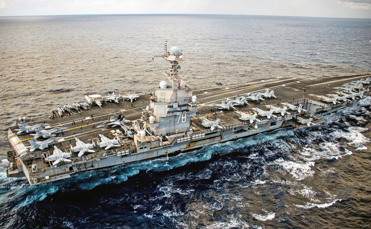 World’s largest aircraft carrier, USS Gerald R. Ford, in Mediterranean Sea March 22. U.S. Navy says its “warfighting effectiveness, lethality” is to defend U.S. rulers’ “interests in the region.”