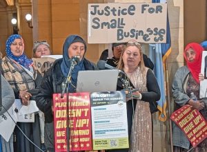 Zahra Abdalla, a founder of Neighbors United, speaks at news conference at state Capitol in St. Paul April 28 seeking relief from damages small-business owners suffered in ICE reign of terror.