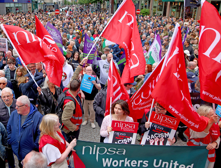 Northern Ireland Public Service Alliance union contingent joins June 13 protest in Belfast against anti-immigrant riots. U.K. parties of all stripes are pushing crackdown on immigration.