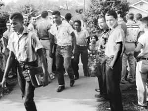 Defying Ku Klux Klan threats, Bobby Cain led Black students into Clinton High School in Tennessee in 1956. He was the first Black to graduate from a desegregated school in the South.