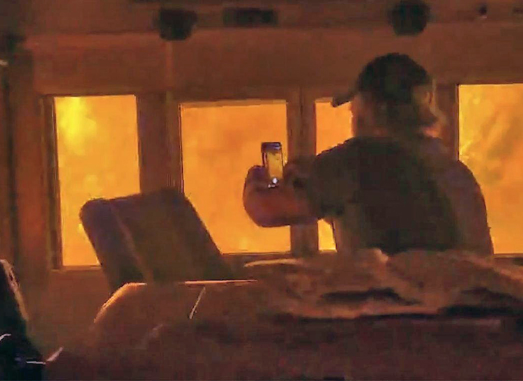 Canadian National Railway crew, above, narrowly escaped wildfire near Armstrong, Ontario, July 13. Teamsters Canada, the workers’ union, demands CN stop running trains in wildfire areas. “No shipment is worth a human life,” union President Francois Laporte said in a statement.