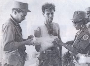 Doctor (right) treats mercenary captured at Bay of Pigs, Cuba, April 1961. No wounded soldiers were left without medical care, just like the Cuban defenders — a matter of principle.