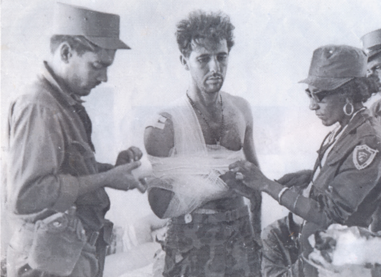 Doctor (right) treats mercenary captured at Bay of Pigs, Cuba, April 1961. No wounded soldiers were left without medical care, just like the Cuban defenders — a matter of principle.