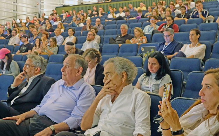 Audience at second international Contemporary Antisemitism conference July 7-9 in Haifa, Israel. Inset, Cochav Elkayam-Levy, from Civil Commission on October 7th Crimes by Hamas Against Women and Children, speaks at the conference.