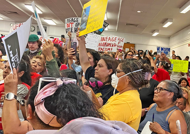 Residents protest July 9 in Boyle Heights area of Los Angeles over lack of action by city authorities to aid those affected by toxic air, water from fire at Lineage food warehouse June 17.