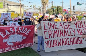 Workers picket outside July 9 town hall meeting protesting inaction by Los Angeles officials and Lineage owners after 85 million pounds of food rotted in neighborhood after June 17 fire.