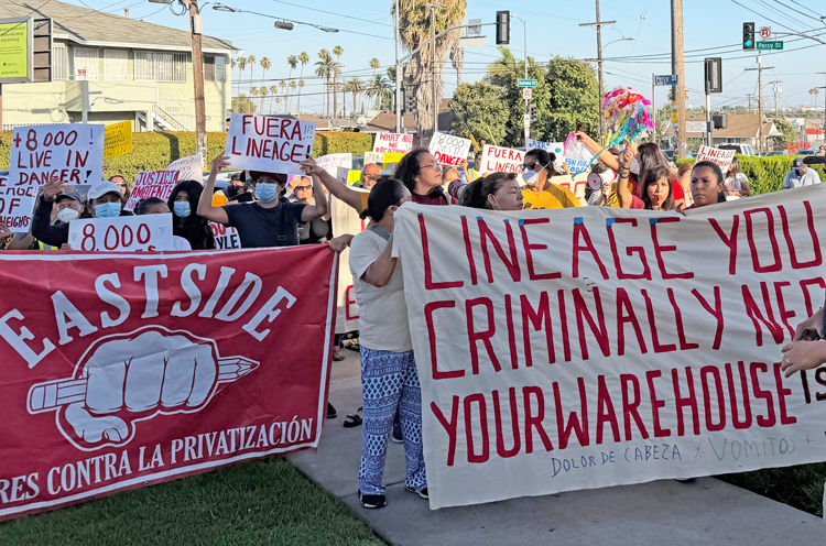 Workers picket outside July 9 town hall meeting protesting inaction by Los Angeles officials and Lineage owners after 85 million pounds of food rotted in neighborhood after June 17 fire.