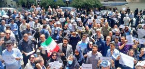 Nurses and other healthcare workers protest low wages and benefits, rising prices and poor working conditions in Tehran June 29. “Our rights are won only by taking to the streets,” said the nurses’ council.
