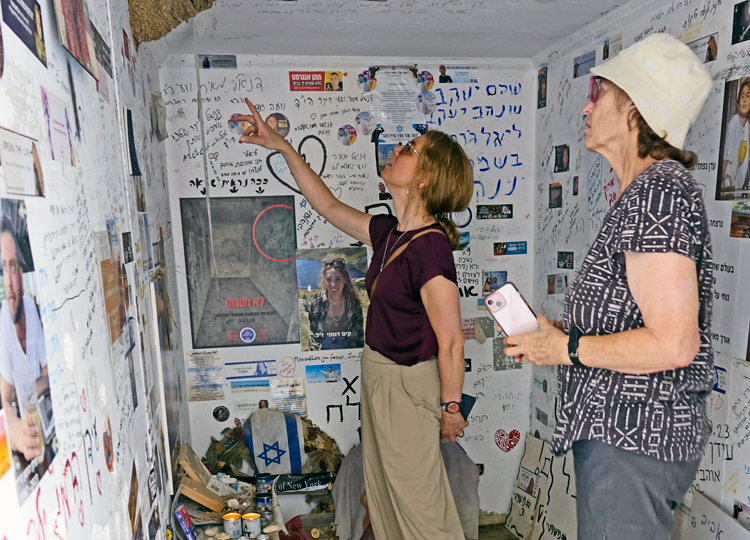 SWP member Rachele Fruit, right, and CL member Ólöf Andra Proppé view bus stop near Re’im kibbutz, where 27 people seeking refuge Oct. 7, 2023, were murdered by Hamas thugs.
