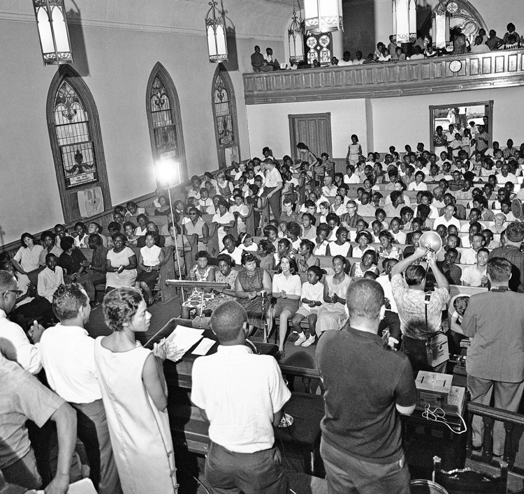 Gloria Richardson, front in white dress, leads rally in Bethel AME Church in Cambridge, Maryland, July 23, 1963. Movement drew thousands of workers into fight for Black rights.