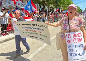 Cuba solidarity contingent in Puerto Rican People’s Parade in Chicago, June 13. U.S. rulers are escalating attacks on Cuba’s sovereignty and socialist revolution, while targeting its supporters.