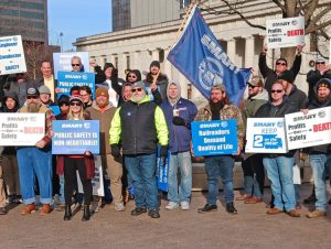 Rail unionists rally in Columbus, Ohio, Dec. 13, 2022. Rail bosses, seeking to boost profits, keep cutting crews, undermining both the safety of workers and those who live by tracks.