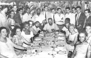 Robert F. Williams, at head of table, representing the Fair Play for Cuba Committee during 1960 visit to Cuba. Williams mobilized Blacks in Monroe, North Carolina, to defend themselves from brutal Ku Klux Klan assaults as they fought to desegregate city, overturn Jim Crow.