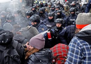 Cops used pepper spray against truckers, supporters during 2022 protests in Ottawa. Preparing for bigger class battles to come, Canadian rulers are escalating attacks on the unions, political freedoms of working people. Bill C-22 will strengthen police powers, government spy agencies.