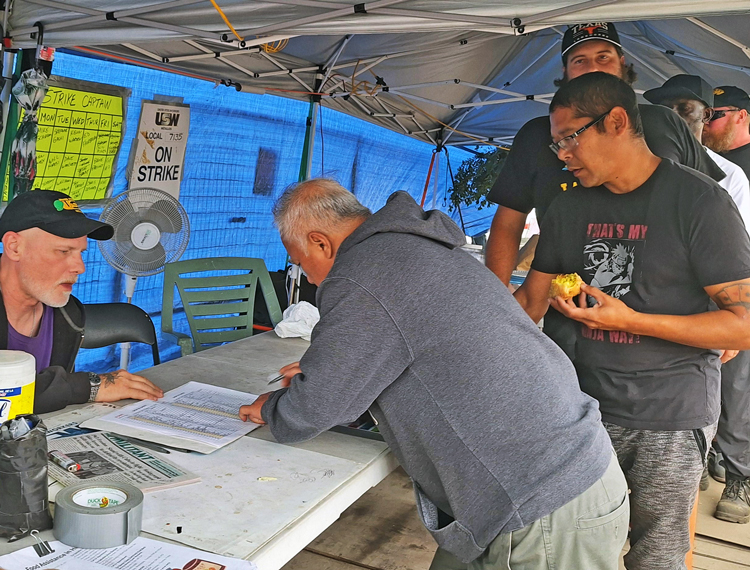 Strikers at National Steel Car in Hamilton, Ontario, sign up to picket Sept. 17. Incentive pay speedup, safety are key issues — seven workers have been killed on the job since the 1970s.